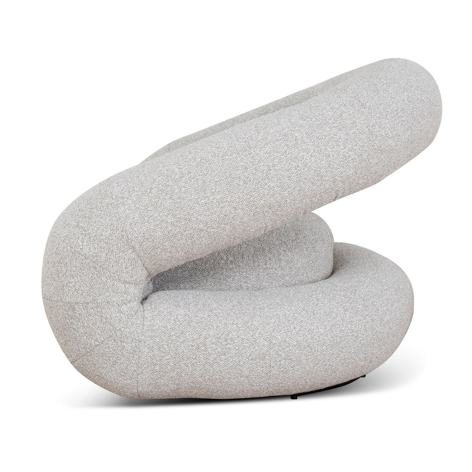 Looped backrest and curved arms of the Odette swivel armchair