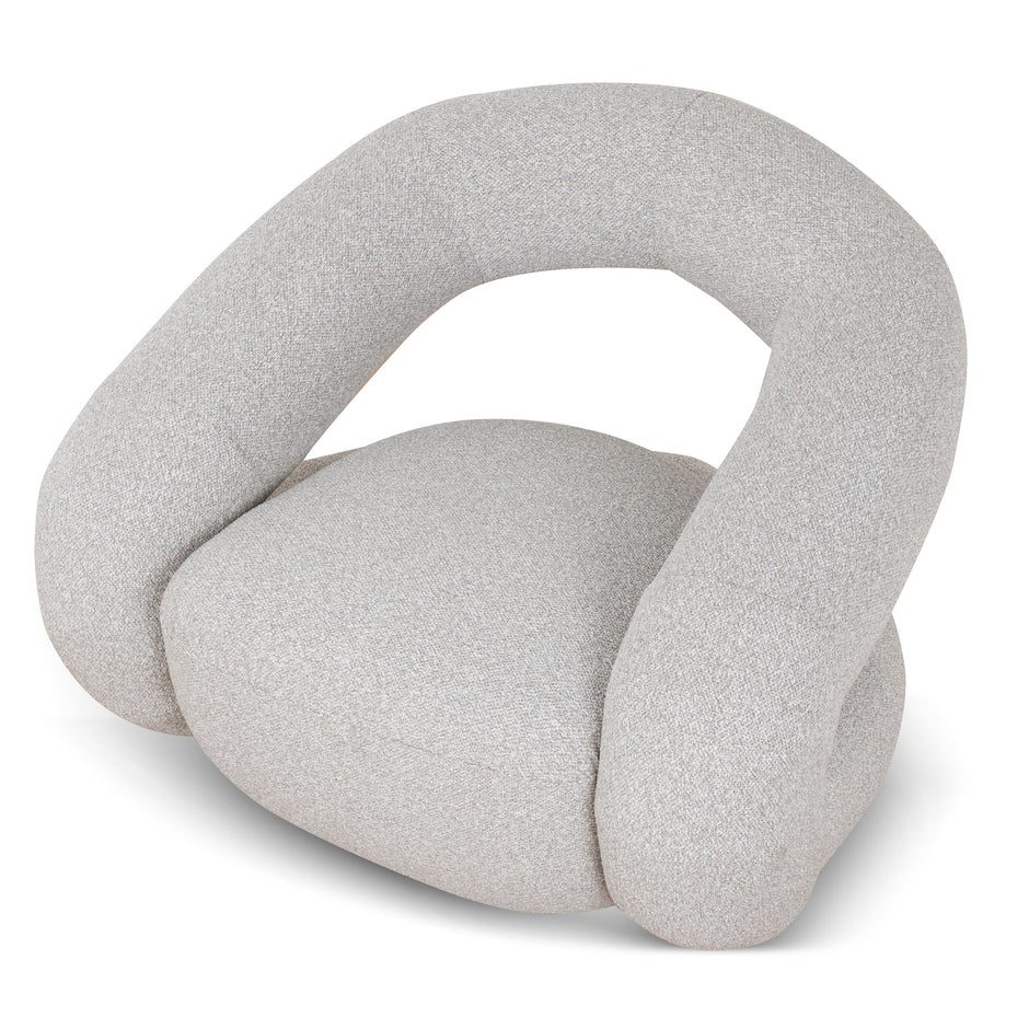 Odette Clay Grey swivel armchair in a modern living room
